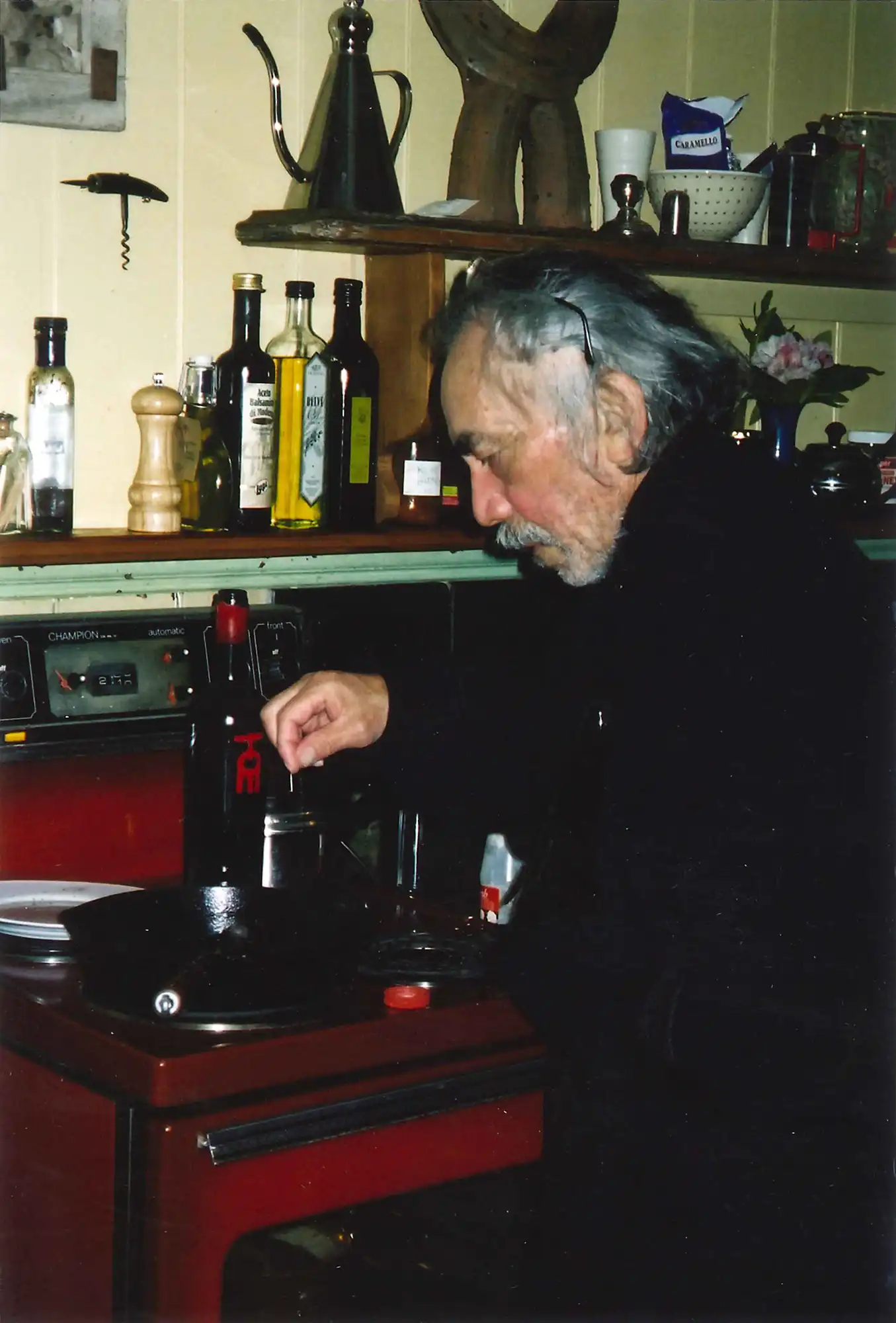 Photograph of Ralph Hotere cooking at 25 George Street, Port Chalmers, May-June 2002. Private Collection