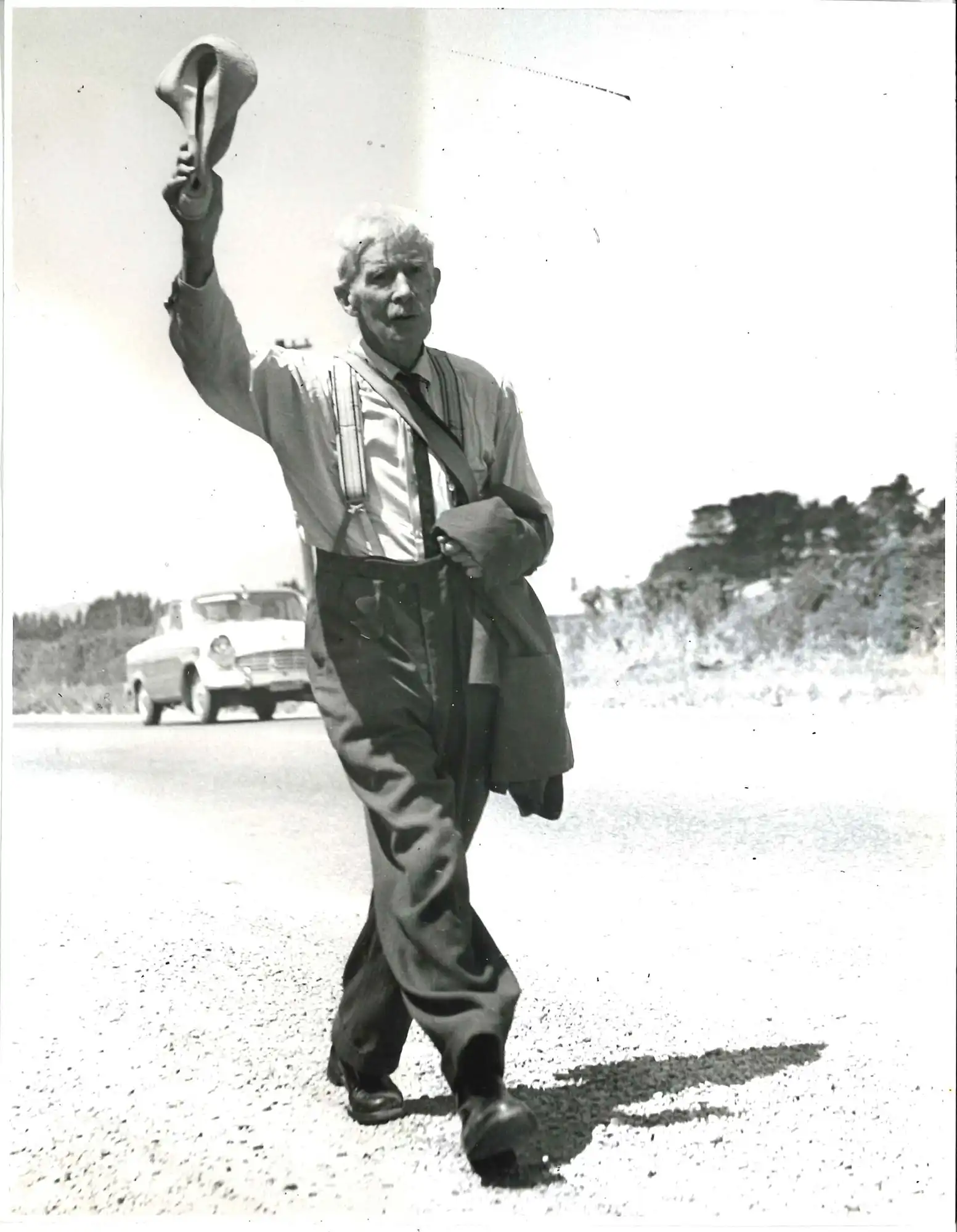 Photograph of A.H. Reed walking (Christchurch Star)
