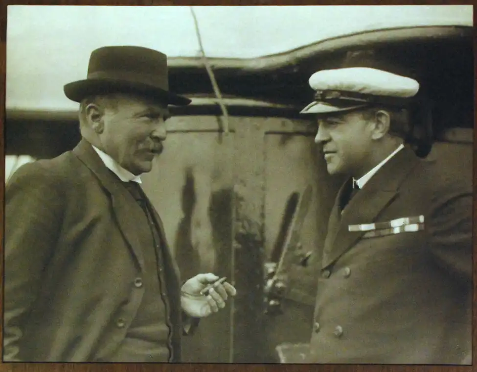 Photograph (framed). ‘Dr Robert McNab and Sir Ernest Shackleton. Departure of the “Aurora” for Ross Sea on her Relief Expedition, December 20th 1916’.